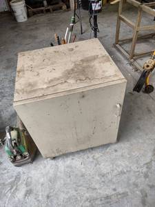 lot 1279 image: 24x22x29 metal cabinet on rollers and contents