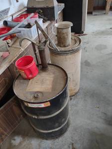 lot 1293 image: oil drum with pump and contents and cardboard barrel and contents