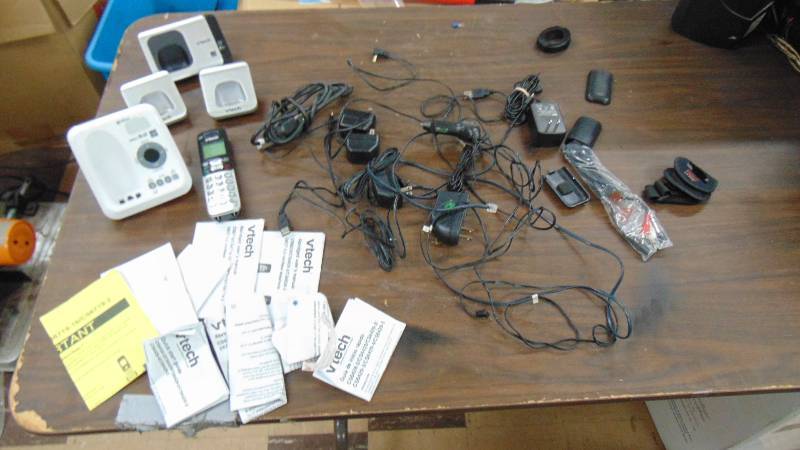 lot 543 image: Vtech phones and power supplies