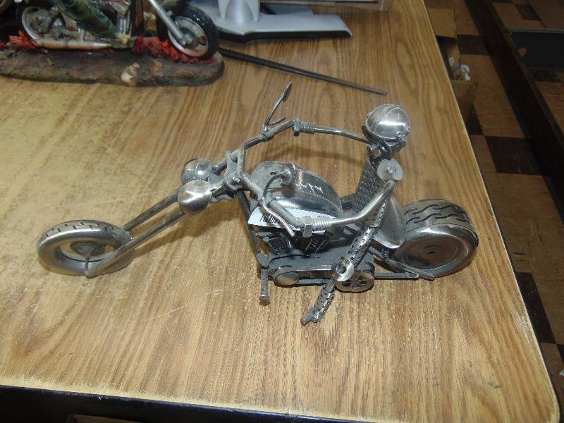 lot 639 image: metal Guy on Chopper made of car parts
