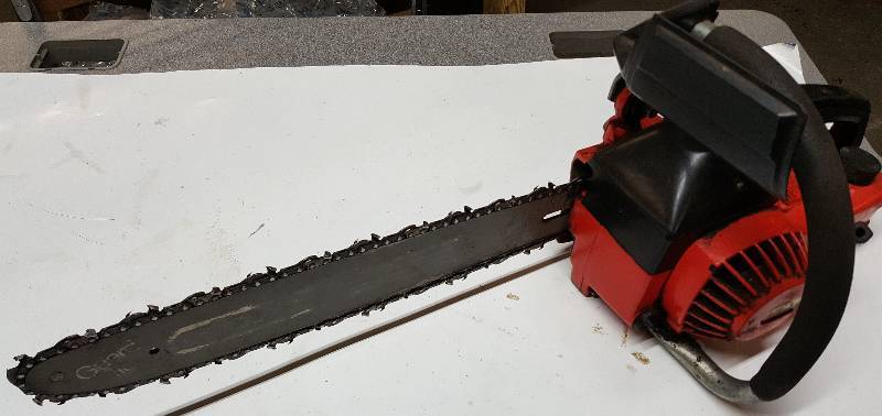 lot 5293 image: Good compression on this Craftsman gas powered chain saw.  Several years since it was started