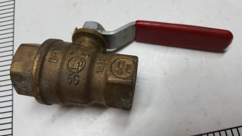 lot 5306 image: Slightly used is this 90 degree 12 female pipe shut off ball valve.  Always handy to have in the shop or garage.