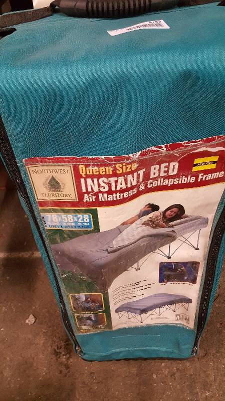 lot 5233 image: If youve ever had to sleep in the dog house, this might help next time.  A queen size INstant Bed with collapsible frame and air mattress
