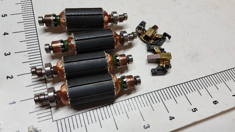 lot 5284 image: 4 new small electric motor armatures and looks like they have an off center bearing so to vibrate or oscillate in the motor