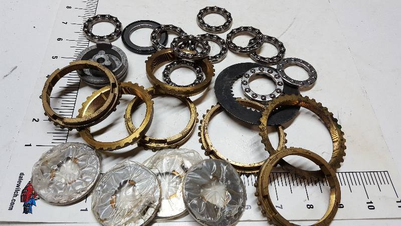lot 5239 image: Assorted thrust ball bearings, bronze thrust washers and some brass synchronizer transmission rings.