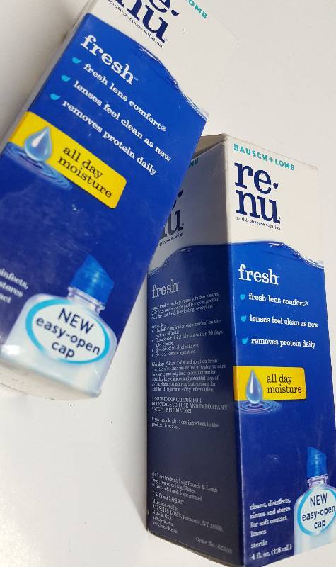 lot 5265 image: A pair of 4 fluid ounce big bottles of the RE-Nu soft contact lens cleaner and disinfectant.