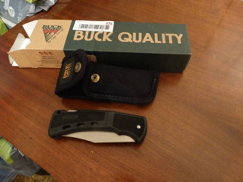 lot 375 image: Buck knife w sheath
