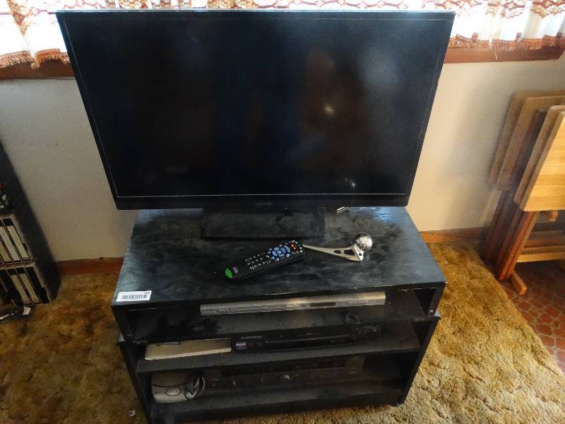 lot 535 image: Media stand- 32 LCD TV- DVD player- VHS player- JVC receiver.