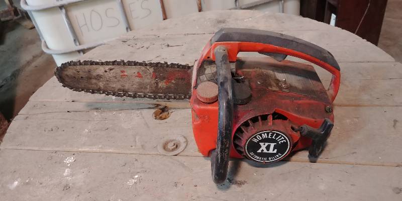lot 6766 image: Homelite XL Chainsaw Needs Serviced
