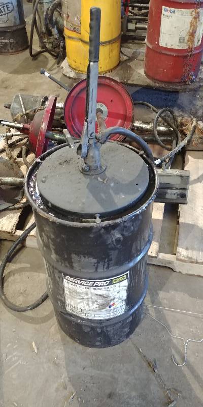 lot 6620 image: Manual Grease Barrel Pump with Barrel of Service Pro Gear Lube 80W-90 LS Approx 12 Full
