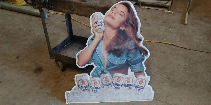 lot 6630 image: Anheuser-Busch Natural Light Pressed Metal Sign