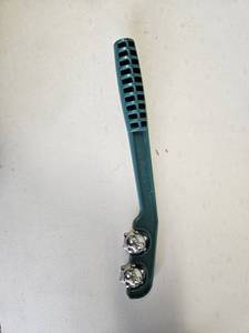 lot 148 image: Some kind of plastic metal magnet roller handheld