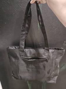 lot 171 image: Medium carry bag from Tribal brand, lightly used, has small inside pocket and small outside pocket and zipper to zip main part closed