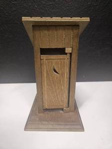 lot 186 image: Music box toilet out house, vintage, tested and works but door doesnt always open and close with it