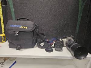 lot 201 image: Used Canon EOS Rebel 2000 Camera, untested because needs new batteries, has Tamron telephoto lense