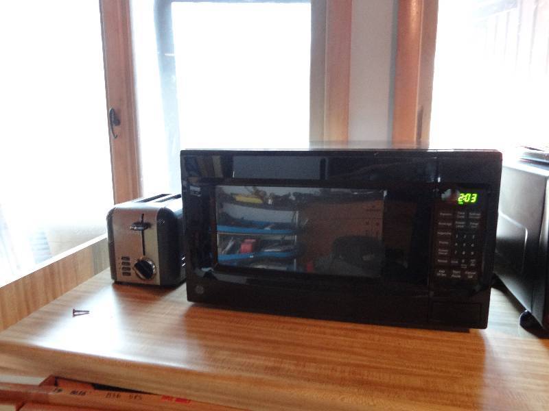 lot 6303 image: Black GE Microwave and Cuisinart Toaster