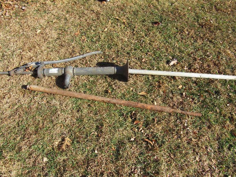 lot 6203 image: Cast Iron Water Pump & Metal Rod