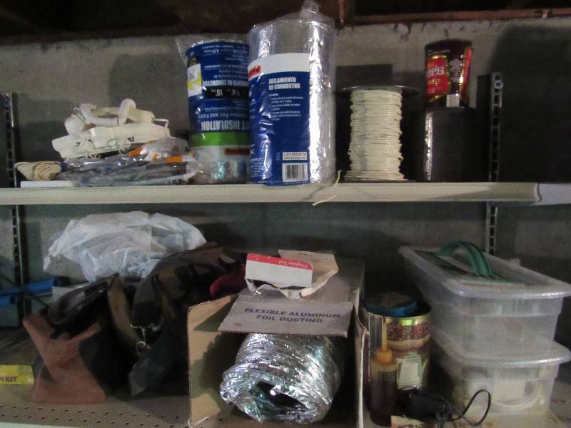 lot 6423 image: Contents of top(2) shelves duct insulation, wiring, weather proofing and more