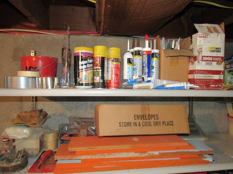 lot 6427 image: Contents of top (2) shelves insulation, caulk, wire, gloves and more
