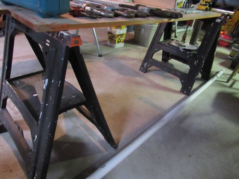 lot 6458 image: (2) plastic saw horses