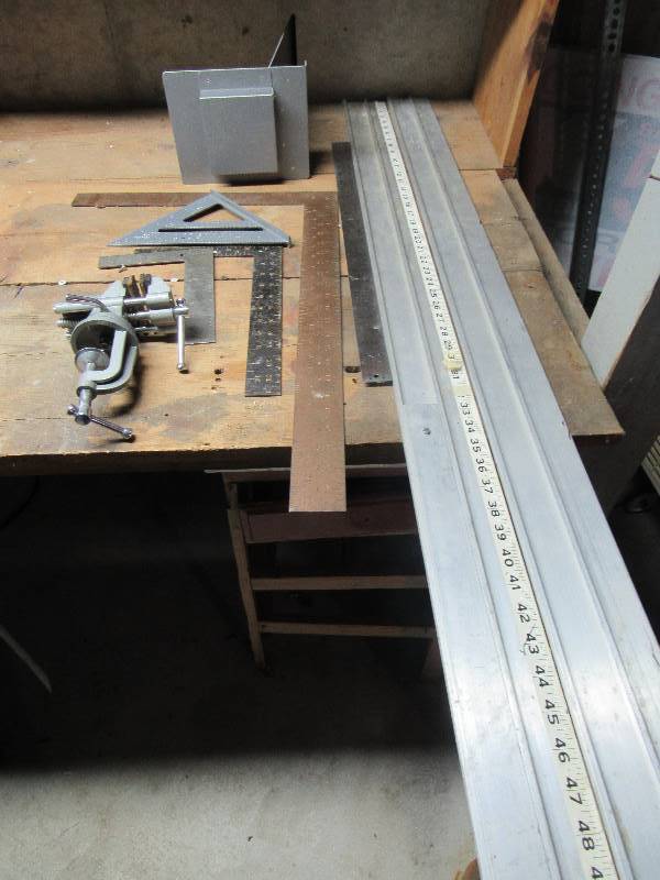 lot 6468 image: (9) ct. lot of rulers, squares, speed square, small bench vise