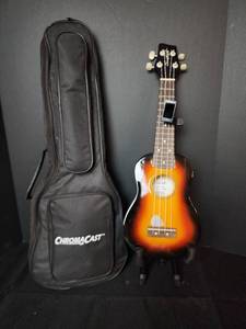 lot 172 image: Vintage Sawtooth Ukulele with Bag and Stand