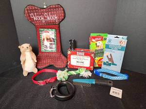 lot 284 image: New Dog Christmas Stocking, Toys, (2) Medium Collars, Comb, Waste Bags, and Safety Leash Handle