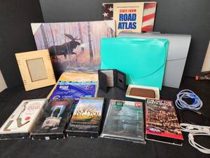 lot 328 image: Road Atlas, Picture, File Folders, Yellow Envelopes, VHS Movies, Leather Paper Weight, and More