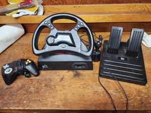 lot 626 image: Mad Catz Analog Steering Wheel for Nintendo 64 and Nintendo 64 Gaming Control