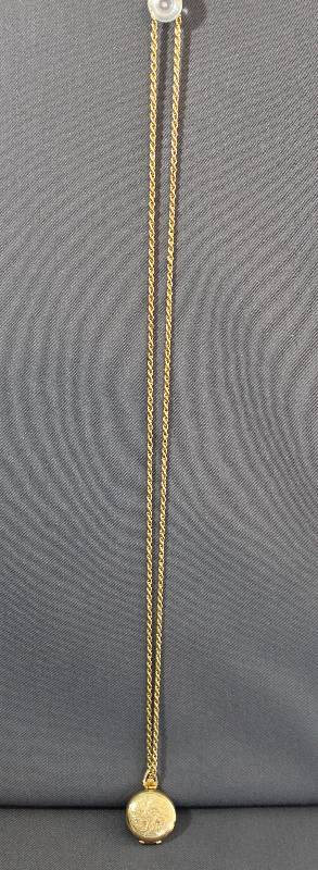 lot 4023 image: Really Nice Gold Tone Locket Necklace that Holds 4 Photos w Etched Design