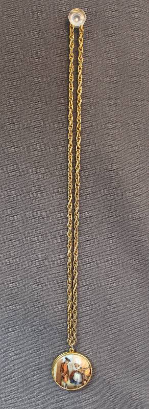 lot 4024 image: Neat Gold Tone Locket with Mid-Century Design of Man and Woman
