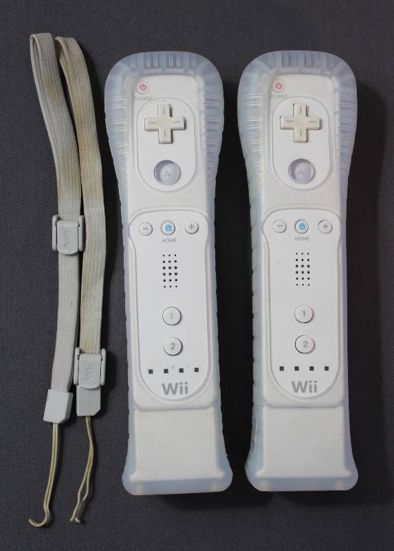 lot 4068 image: Two White Nintendo Wii Controllers w Gel Case and Extended Battery