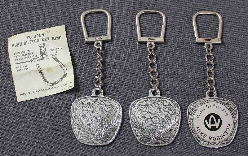 lot 4129 image: Three Ornate Push Button Key Rings w Thanks for Your Help MIKE ROBINSON