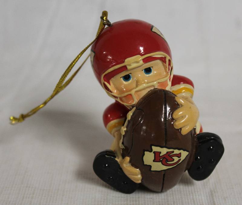 lot 4161 image: Cute Kansas City Chiefs Ornament features Player holding Football