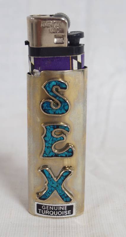 lot 1083 image: Genuine Turquoise Lighter Holder spells SEX woo-woo