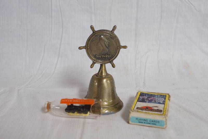 lot 1086 image: Sea World Bell, Silver Dollar City Train and Playing Cards