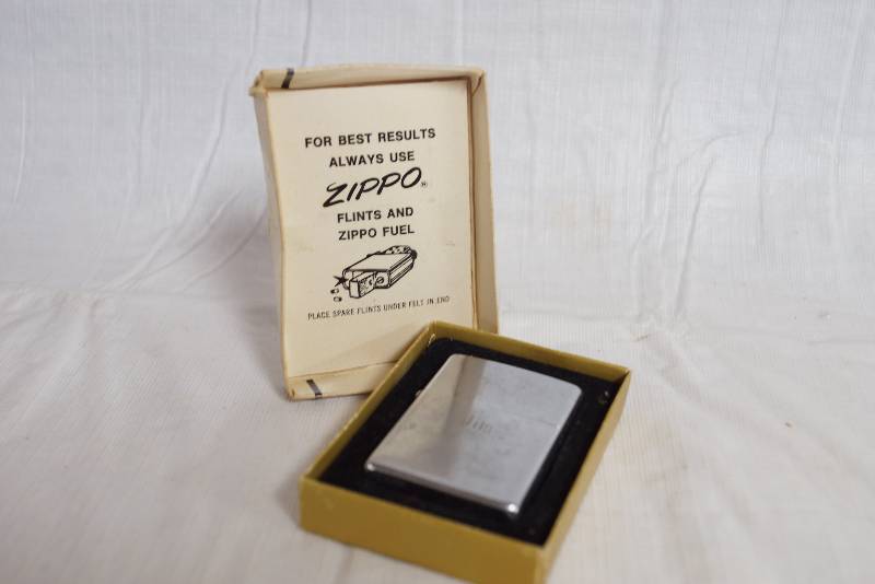 lot 1136 image: Vintage ZIPPO Lighter in original Box - Engraved Jim - No. 200 Brush Finish