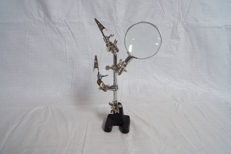 lot 2408 image: Jewelry Repair Stand w lots of slips and magnifying glass
