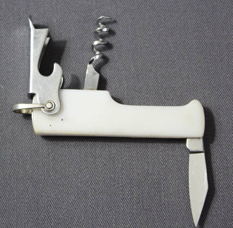 lot 9052 image: 3 White Plastic Pocket Folding Multi-Tool with Key Ring. Bottle Open and Knife.