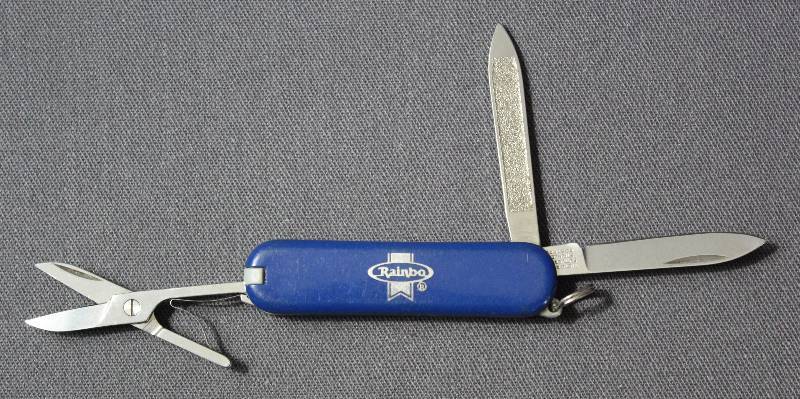 lot 9058 image: Vintage 2.25 Victorinox Folding Multi-Tool Pocket Knife. Rainbow. Switzerland.