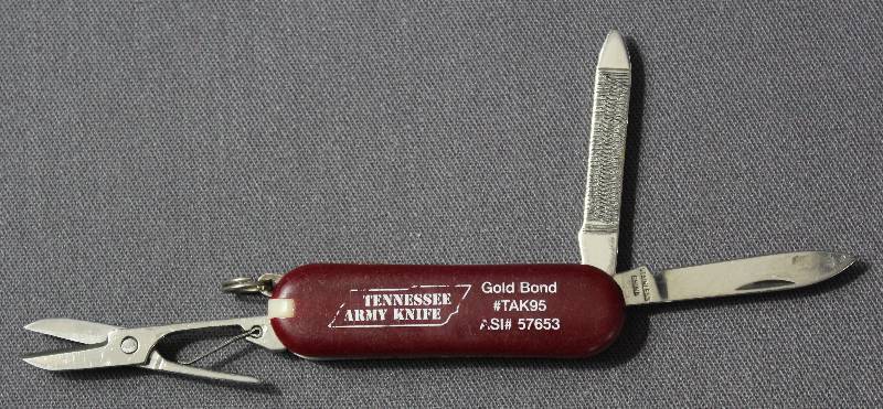 lot 9059 image: Vintage 2.25 Red Folding Multi-Tool Pocket Knife. Tennessee Army Knife Ad