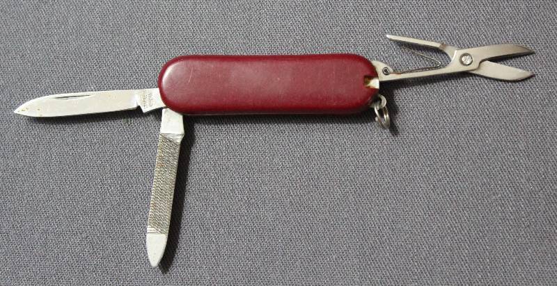 lot 9064 image: 2.25 Red Plastic Folding Multi-Tool Pocket Knife with Key Ring.