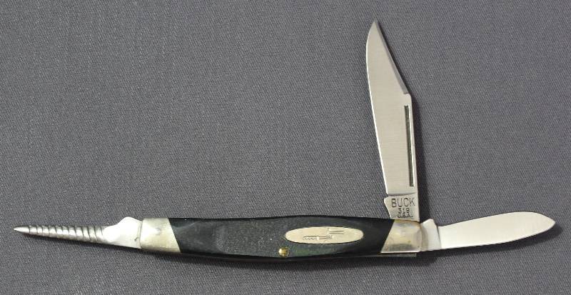 lot 9113 image: Vintage Buck 319 - 4 Folding Multi-Tool Pocket Knife. USA Made.