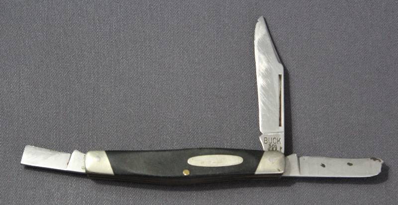 lot 9114 image: Vintage Buck 301 - 4 Folding Multi-Tool Pocket Knife. USA Made.
