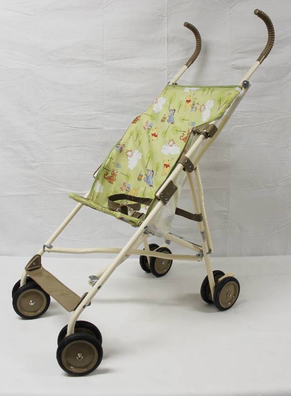 lot 9184 image: Child Winnie the Pooh Folding Stroller. Model 05032AIP
