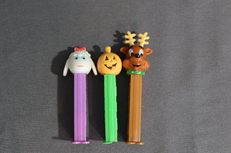 lot 9452 image: 3 PEZ Dispensers - 1979 Sheep, 2002 Reindeer, & Pumpkin.