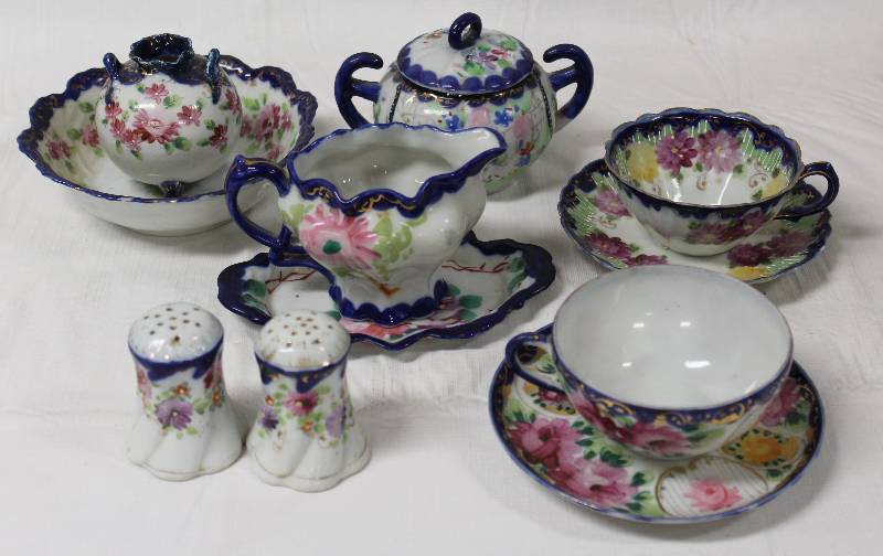 lot 9303 image: Tea Set - Salt & Pepper Shakers, Creamer, Sugar, Teacups.