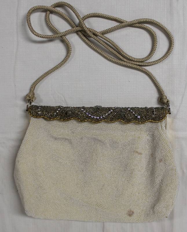 lot 9307 image: Jason Magnin Micro-Beaded Clutch Purse.