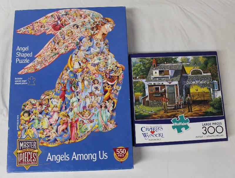 lot 9318 image: Puzzles - Angels Among Us and Charles Wysocki Buffalo