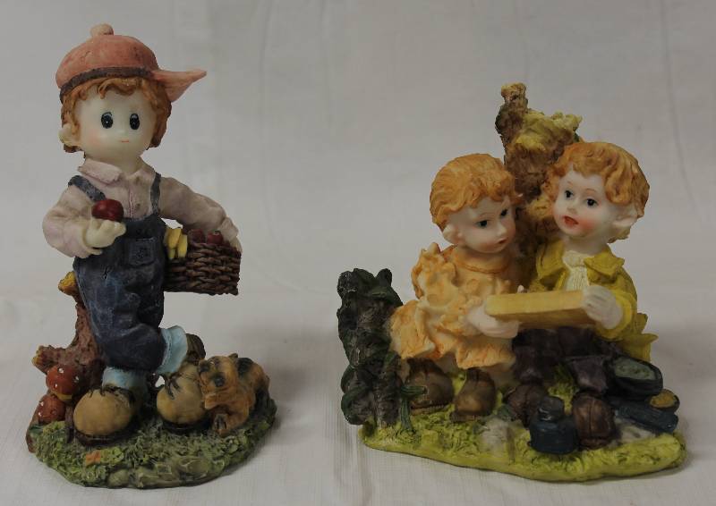 lot 9328 image: Two Kid Figurines with Animals.